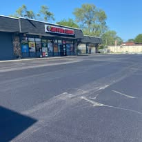 New asphalt surface in front of local businesses
